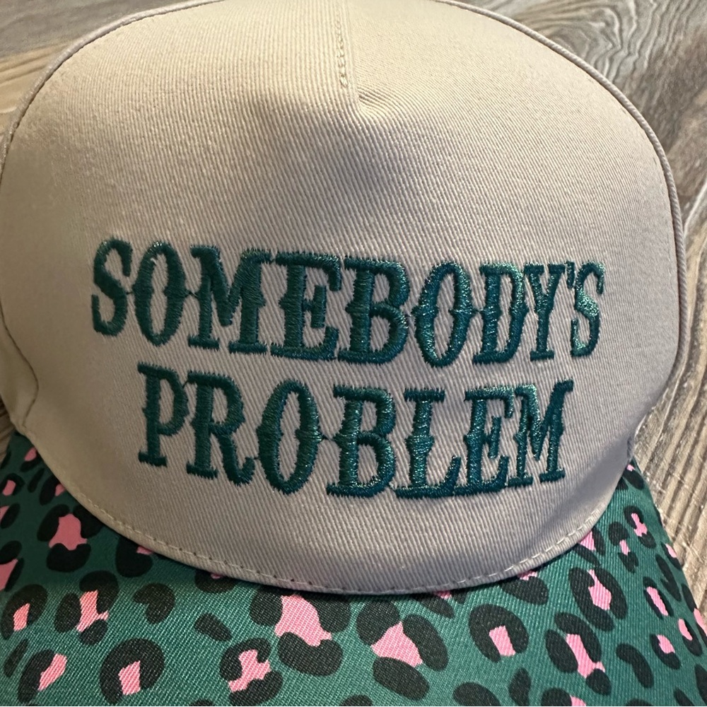 Brand new! Women’s Somebody’s Problem Trucker hat